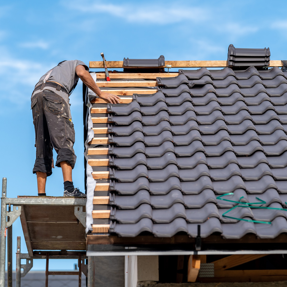 Roffer working on roof replacement in Weston-super-Mare